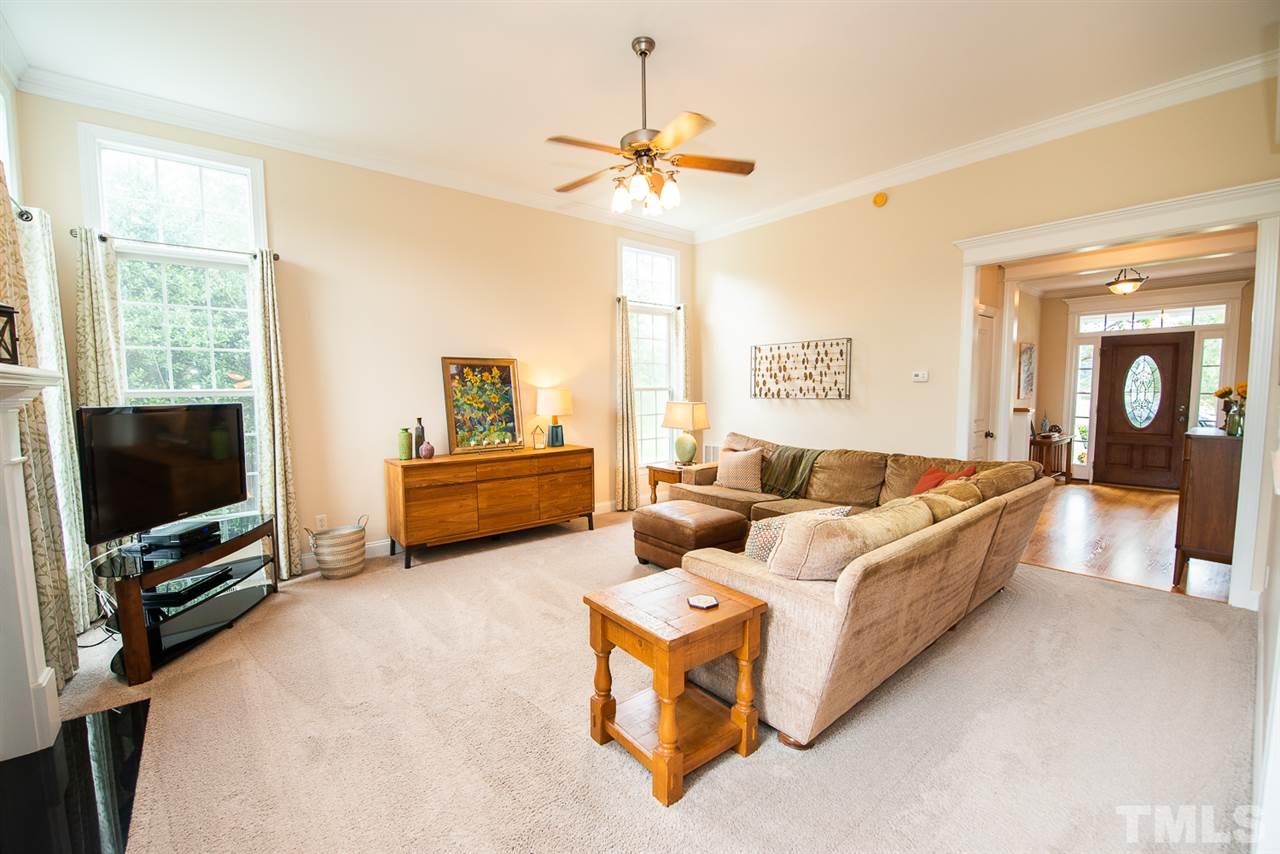 81 Rand Road Raleigh, NC 27603 - Photo 4 of 24 a living room with furniture and a flat screen tv