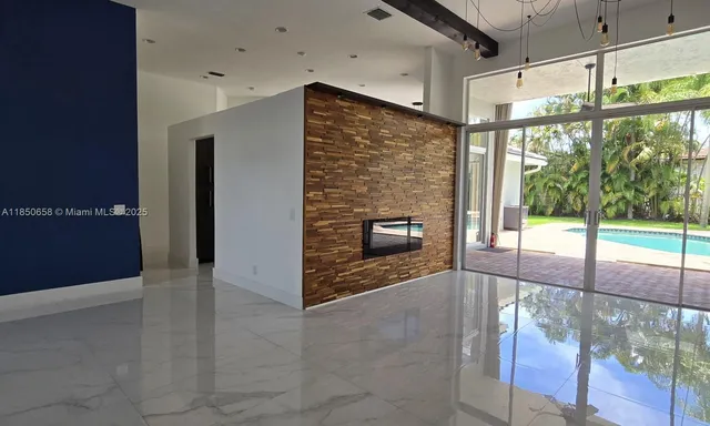 a view of an empty room with glass door