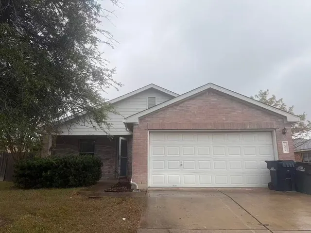 a front view of a house with garage