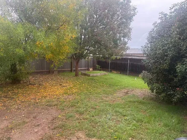 a swimming pool with outdoor seating and yard