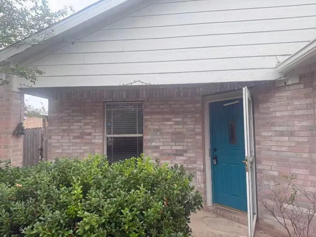 a brick building with a large windows