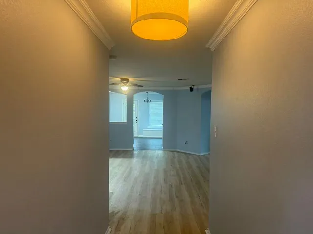 a view of a room with wooden floor and shower
