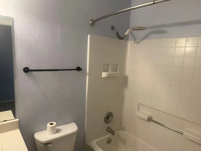 a bathroom with a sink and a shower