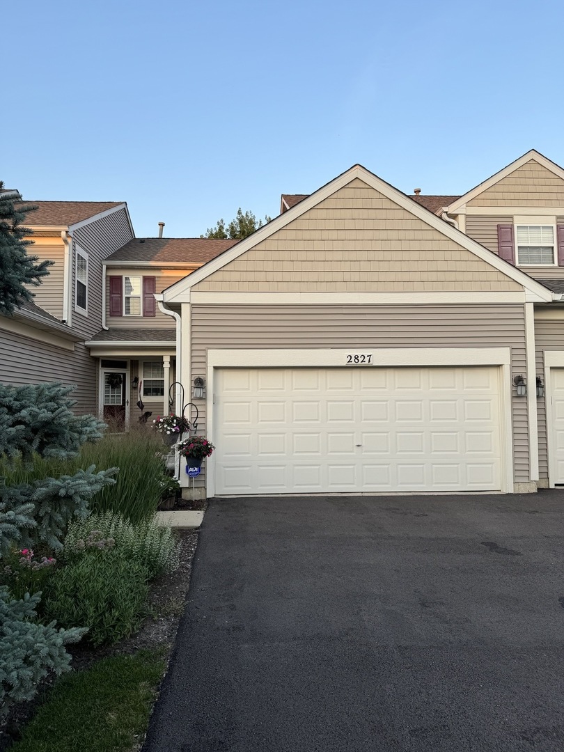 2827 White Thorn Circle Naperville, IL 60564 - Photo 1 of 26 a front view of a house with a yard and garage