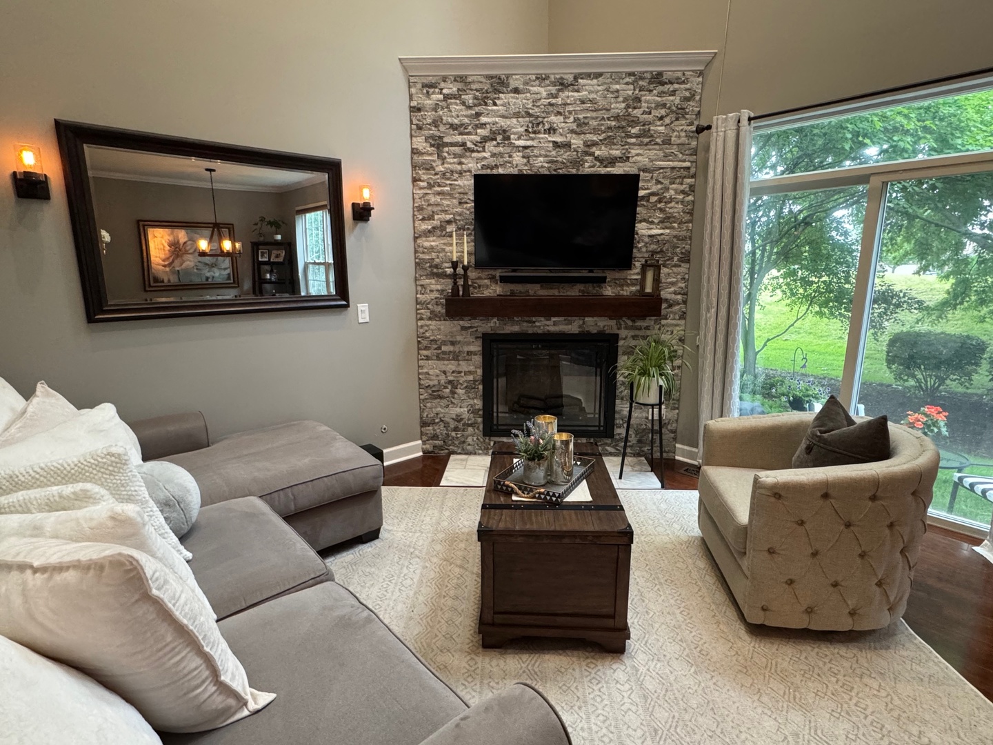 2827 White Thorn Circle Naperville, IL 60564 - Photo 11 of 26 a living room with furniture a fireplace and a flat screen tv