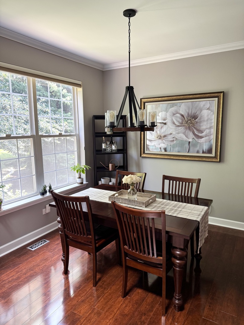 2827 White Thorn Circle Naperville, IL 60564 - Photo 10 of 26 a view of a dining room with furniture window and wooden floor