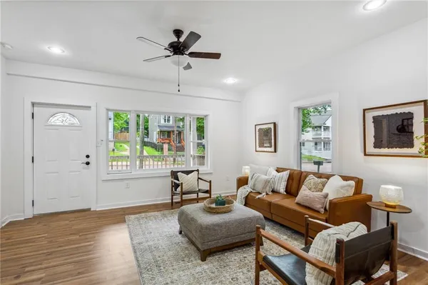 a living room with furniture and a window