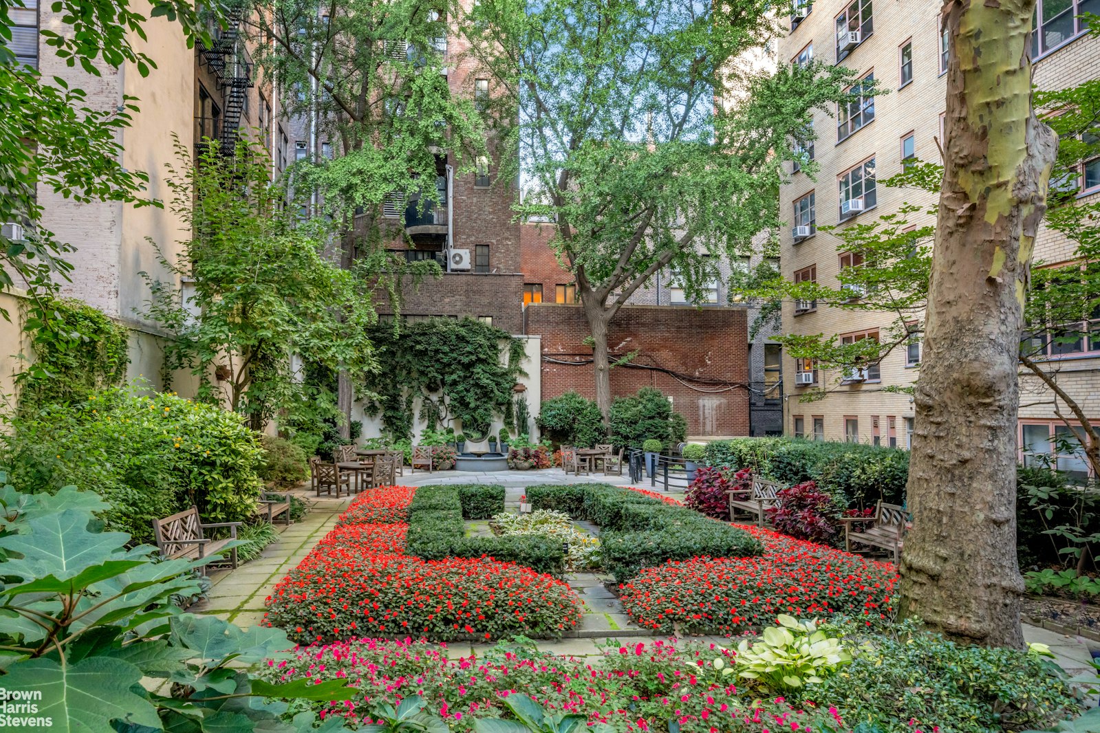 235 East 22nd Street, Unit 1EF Manhattan, NY 10010 - Photo 14 of 15 an aerial view of a house with a yard and garden