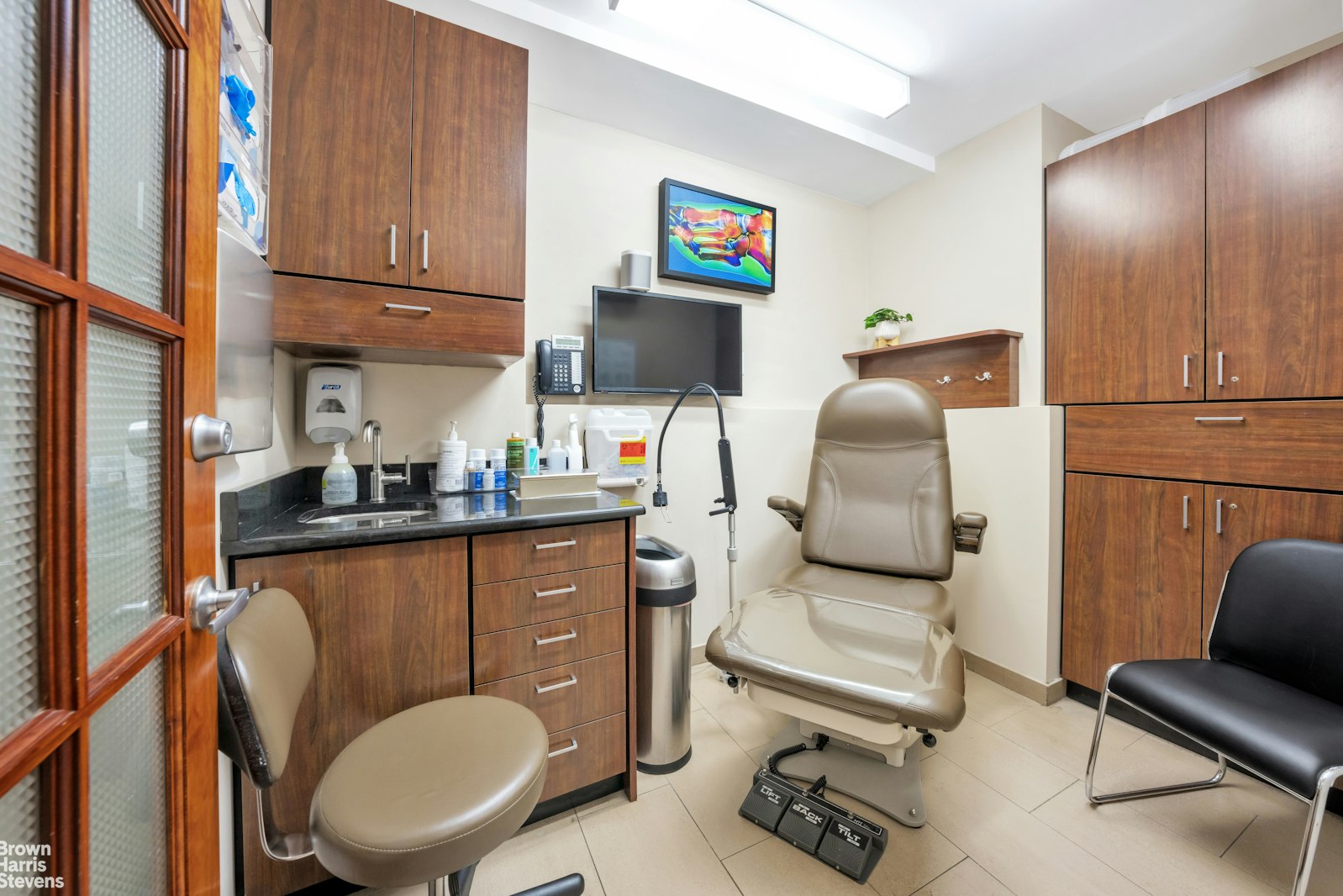 235 East 22nd Street, Unit 1EF Manhattan, NY 10010 - Photo 7 of 15 a living room with furniture and a flat screen tv