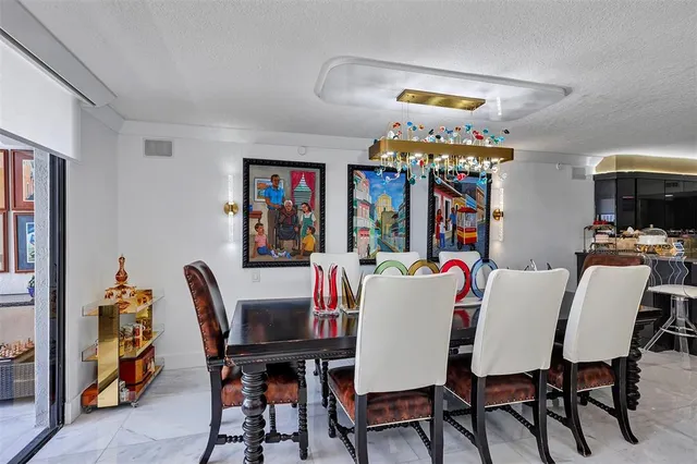 a bedroom with furniture and a large window
