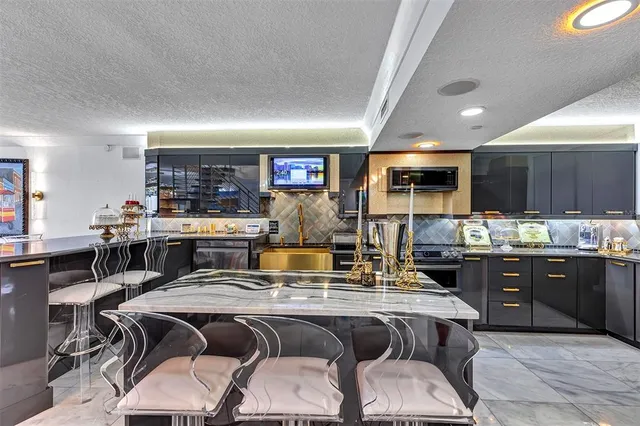 a balcony with outdoor seating and city view