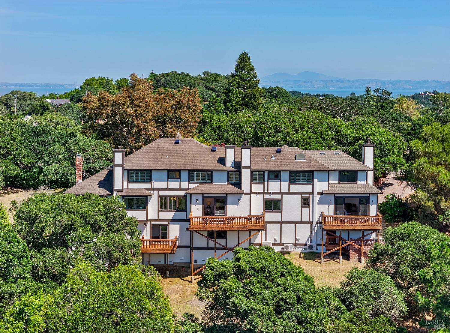 10 Lockton Lane Novato, CA 94945 - Photo 58 of 68 Exterior view of the custom residence, showing its scale, hillside setting, and multiple levels of living space.