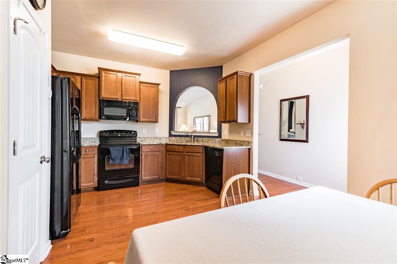 104 Salthouse Road Simpsonville, SC 29680 - Photo 5 of 31 Spacious Kitchen with Peek-a-boo window into living room! All appliances stay including the fridge!