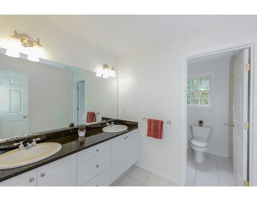30 Canton Dale Canton, MA 02021 - Photo 26 of 32 a bathroom with a granite countertop sink a large mirror and a toilet