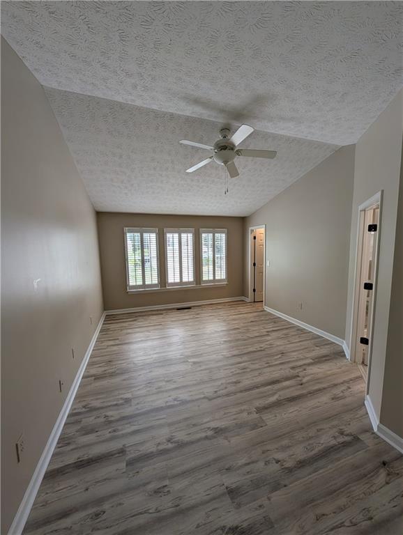 3324 Benthollow Lane Duluth, GA 30096 - Photo 9 of 16 wooden floor in an empty room with a window