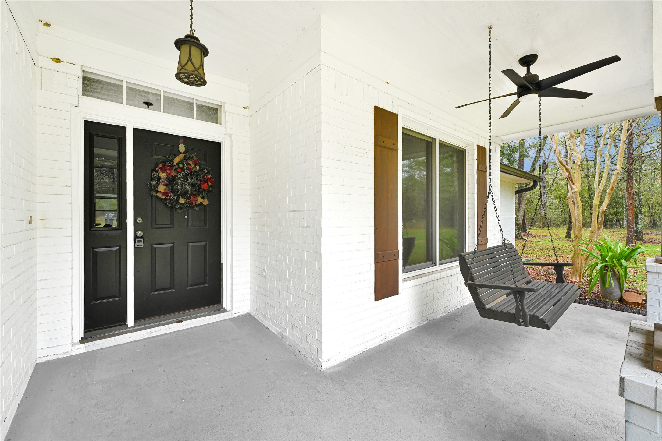 28402 Ascot Farms Road Magnolia, TX 77354 - Photo 7 of 40 Cozy Front Porch With A Wooden Swing