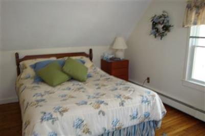 11 Summersea Road Mashpee, MA 02649 - Photo 7 of 12 a bedroom with a bed and a window