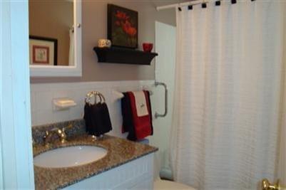 11 Summersea Road Mashpee, MA 02649 - Photo 8 of 12 a bathroom with a granite countertop sink and a mirror