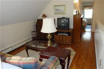 11 Summersea Road Mashpee, MA 02649 - Photo 10 of 12 a living room with chairs and a table