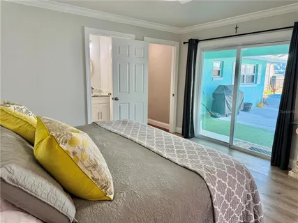 a bed room with a bed and a chair