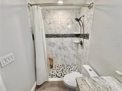 a bedroom with a bed and a mirror