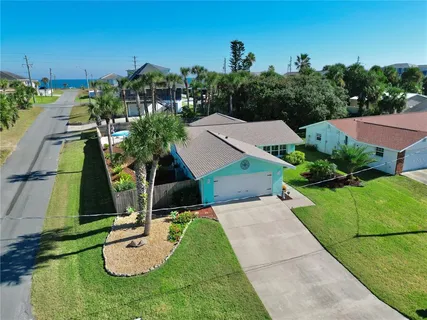 an aerial view of a house with a garden