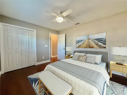 a view of a chair and tables in the back yard of the house