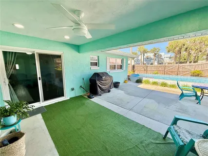 a view of a house with a yard and sitting area
