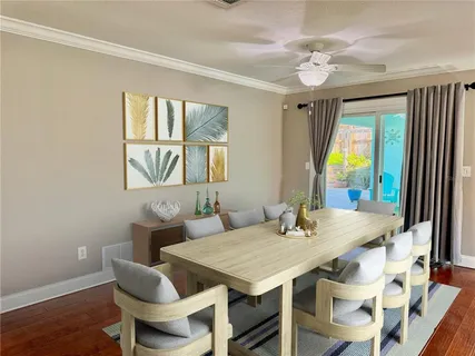 a kitchen with granite countertop white cabinets and stainless steel appliances