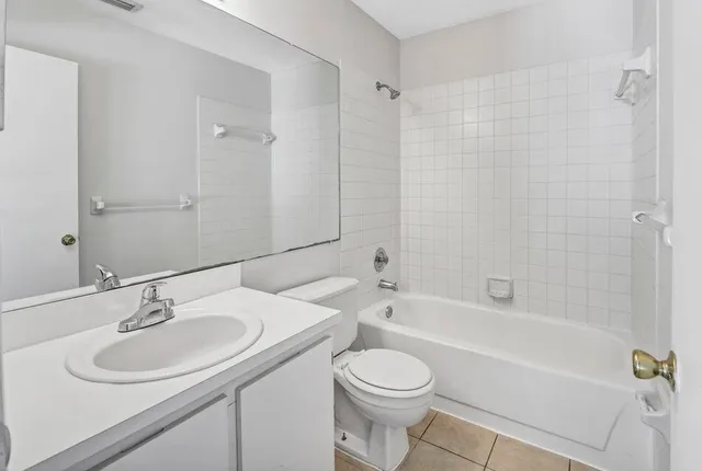a bathroom with a sink toilet a bathtub and a vanity