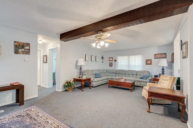 a kitchen with stainless steel appliances a stove a sink a refrigerator and cabinets