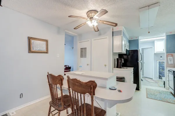 a kitchen with a stove microwave and refrigerator