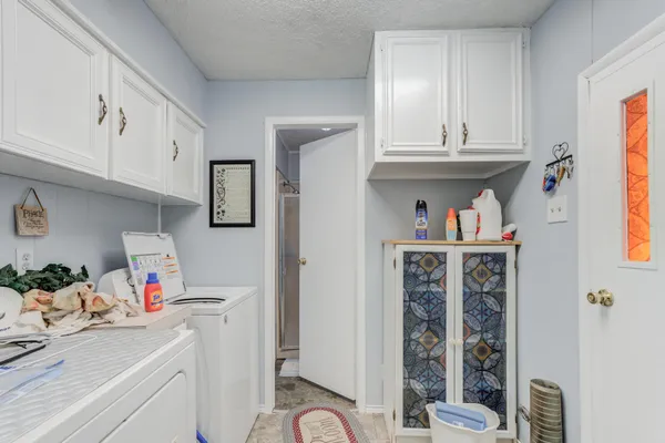 a bathroom with a shower and a sink