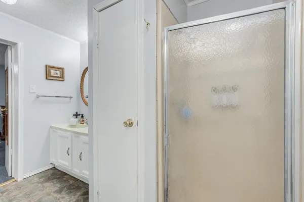 a en suite bathroom with a tub sink and mirror