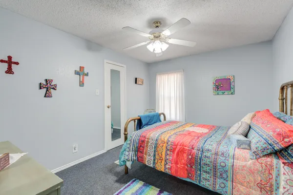 a bedroom with a bed and furniture