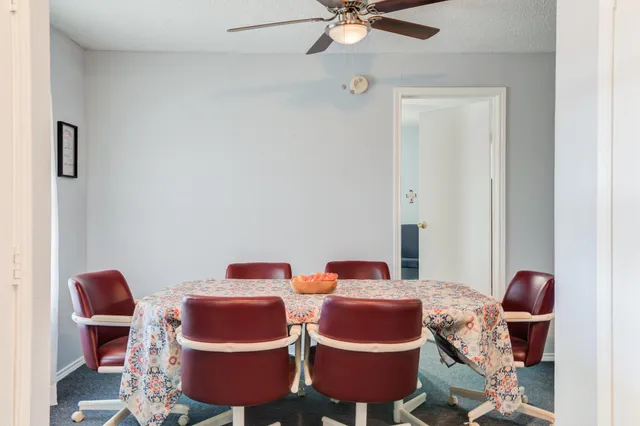 a room with furniture and fan