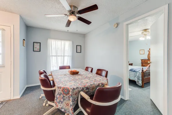 a bed room with furniture and a window