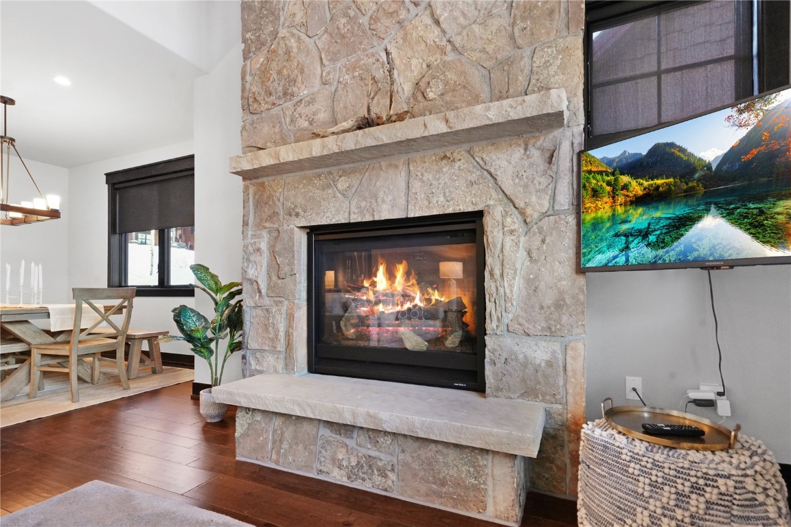 851 Independence Road Keystone, CO 80435 - Photo 8 of 50 a living room with furniture a fireplace and a flat screen tv