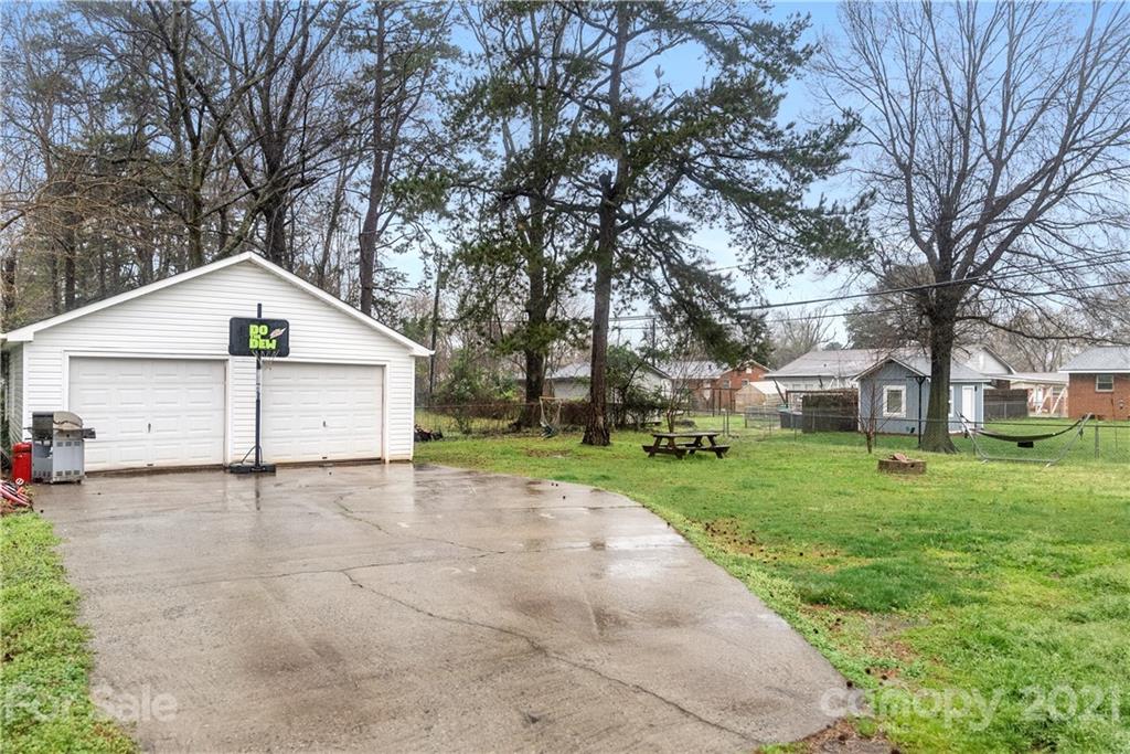 2508 Milton Road Charlotte, NC 28215 - Photo 16 of 17 a view of a house with a yard and large trees