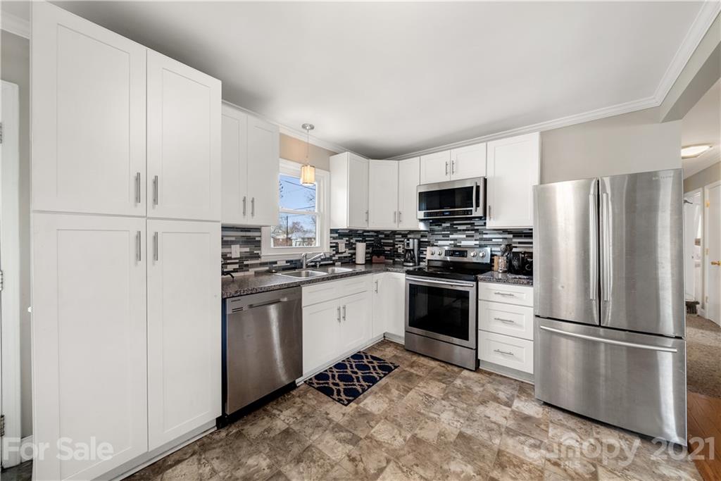 2508 Milton Road Charlotte, NC 28215 - Photo 6 of 17 a kitchen with a refrigerator stove and microwave