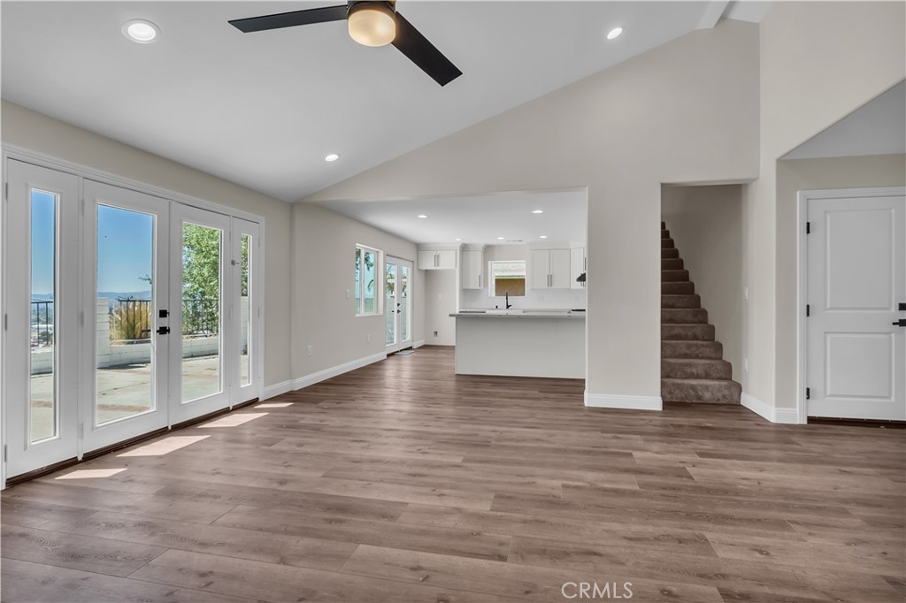 12524 Chanute Street Pacoima, CA 91331 - Photo 12 of 47 an empty room with wooden floor and windows