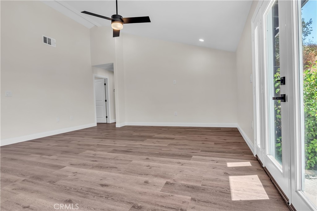 12524 Chanute Street Pacoima, CA 91331 - Photo 18 of 47 a view of a hallway with wooden floor
