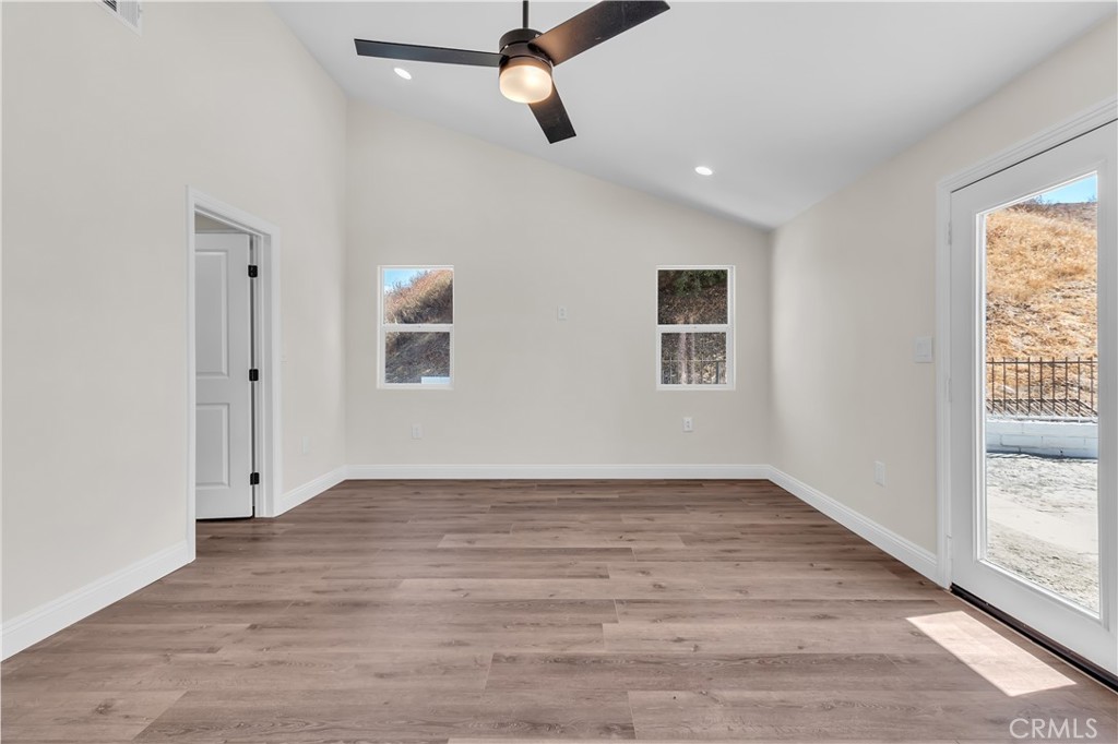 12524 Chanute Street Pacoima, CA 91331 - Photo 22 of 47 wooden floor in an empty room with a window