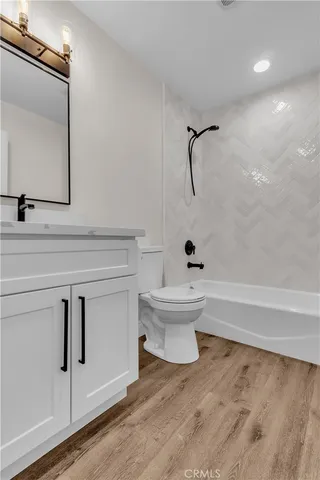 a bathroom with a toilet sink and bathtub