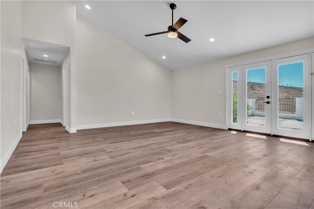 12524 Chanute Street Pacoima, CA 91331 - Photo 10 of 47 a view of empty room with wooden floor