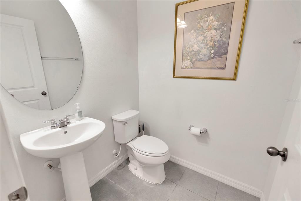 11530 Brighton Knoll Loop Riverview, FL 33579 - Photo 14 of 64 a bathroom with a toilet sink and mirror