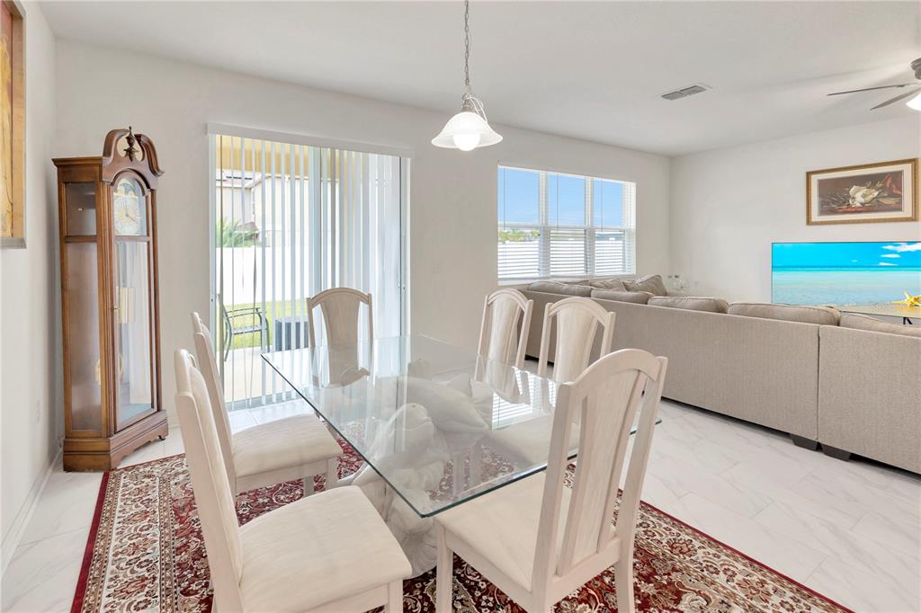 11530 Brighton Knoll Loop Riverview, FL 33579 - Photo 16 of 64 a view of a dining room with furniture window and outside view