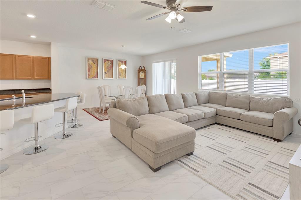 11530 Brighton Knoll Loop Riverview, FL 33579 - Photo 17 of 64 a living room with furniture and a large window