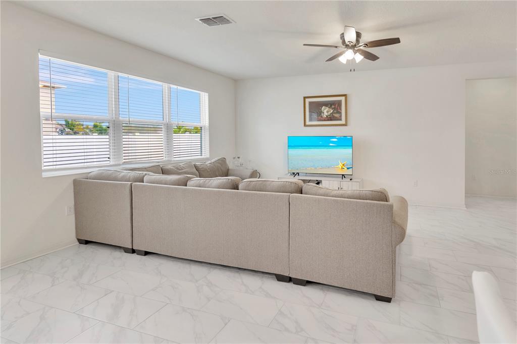 11530 Brighton Knoll Loop Riverview, FL 33579 - Photo 19 of 64 a living room with furniture and window