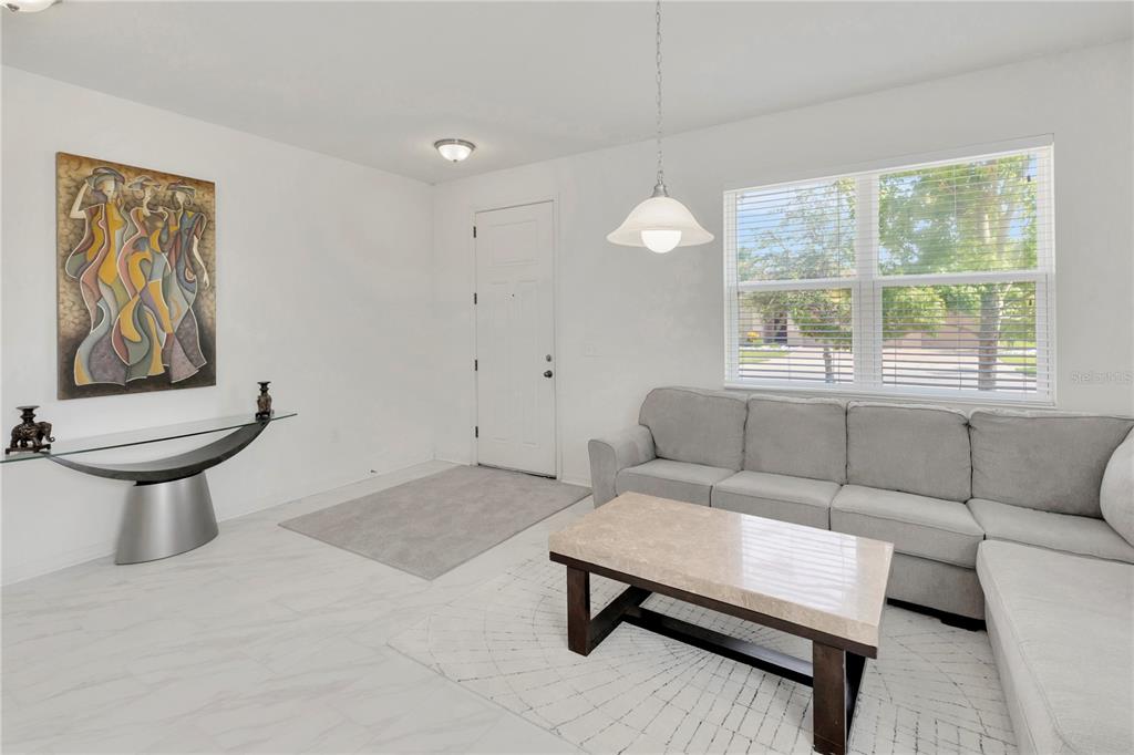 11530 Brighton Knoll Loop Riverview, FL 33579 - Photo 2 of 64 a living room with furniture and a window